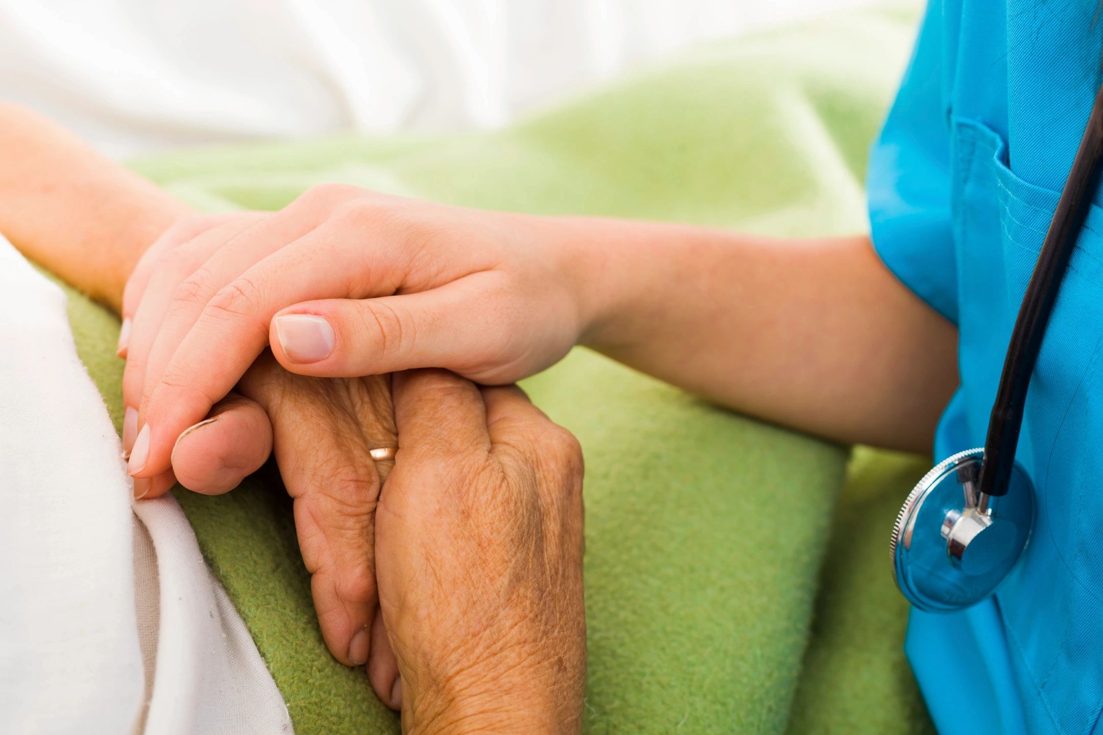 Healthcare provider and patient hands